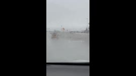 Convertible With Its Top Down in a Freezing Rain Storm