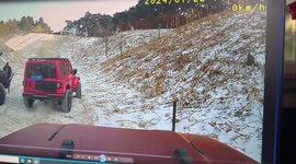 Daredevil driver rolls down snowy hill, narrowly avoids friends and crashes into cars