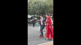 Newlyweds skate down Chinese road in unique wedding celebration