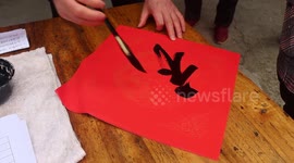 An Artist Writes Free Spring Festival Couplets in Yichang, China