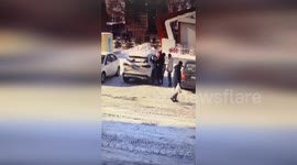 Dad slips on snow but saves his child from hitting ground