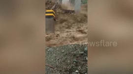 Overflowing river sweeps away hanging bridge in the Philippines