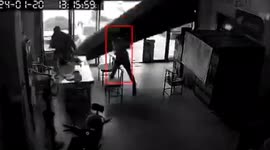 Chinese customer narrowly escapes as roller shutter door unexpectedly plummets