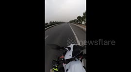 China: Loose Item That Flew Off Truck Narrowly Misses Motorcycle Driver On Highway In Nanjing