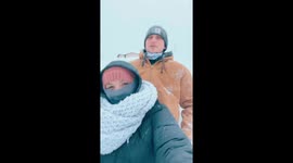 Tandem Sled Frosts Lashes In Snow