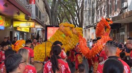 Lion dance procession in Chinatown as part of lunar new year celebrations in Sydney, Australia