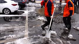 Workers Clear Snow From A Street in Yichang, China