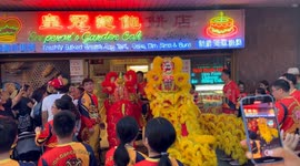 Lion dance procession in Chinatown as part of lunar new year celebrations in Sydney, Australia