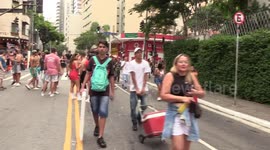 Crowds of people celebrate carnival in the streets of Sao Paulo, Brazil