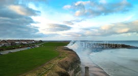 Drone footage shows a grass fire dramatically spreading along cliffs in Tyne and Wear