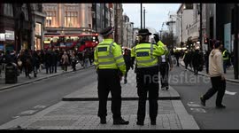 Police Standing in Oxford Street to Protect those in London with the current war