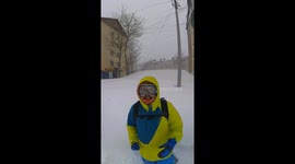 Man Crosses the Street During an Intense Blizzard