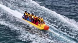 Tourist flips and falls backwards into water during banana boat ride