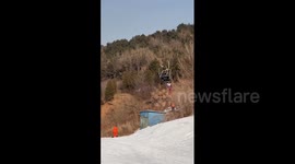 China: Ski Resort Staff Rescue Girl Hanging From Ski Lift In Liaoning