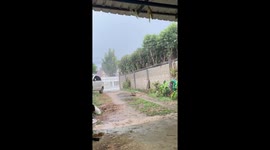Storm blows over garden table in Thailand