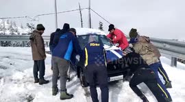 SDRF officials rescue vehicles trapped on road due to snowfall in northern India