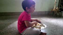 Kid enjoying her lunch beautifully... She is don't worry about how to eat but enjoys his lunch