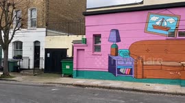 A mural of the iconic living room from The Simpsons adorns a wall outside The Old Eagle pub in London