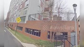 Officers Rescue Woman in Distress on Parking Garage Ledge in Yonkers, USA
