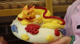 Locals craft vibrant dragon-shaped buns for Chinese New Year