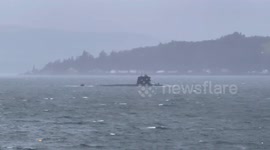 French Submarine sailing on a stormy Loch Long in Argyll Scotland