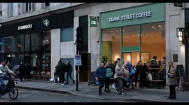 Walking past Starbucks and Blank Street Coffee, London, United Kingdom