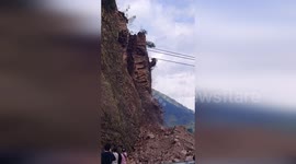Terrifying landslide buries highway as motorists miraculously escape
