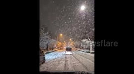 Japan: Vehicles Stuck On Roads As Heavy Snow Hits Greater Tokyo