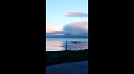 Boat rows across lake as Taal Volcano spews gas