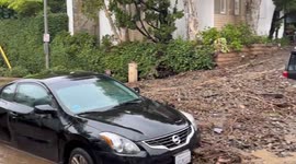 Vehicles left stranded in thick mud as atmospheric river storm hits Los Angeles
