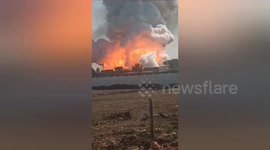 Fire rises smoke from the scene of a 11 people's deadly many injured illegal firecracker factory explosion in Harda, Madhya Pradesh Central India