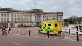 Ambulance parked outside Buckingham Palace and media gather as King Charles III announces cancer diagnosis