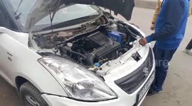 Huge snake rescued from car engine in India