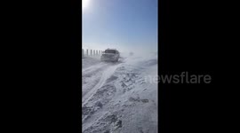 China: Snowstorm Strands Vehicles On Frozen Expressway In Inner Mongolia