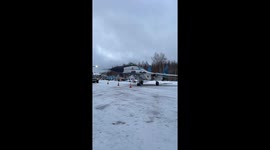 Stuntman's daring leap sees him soar over plane wing
