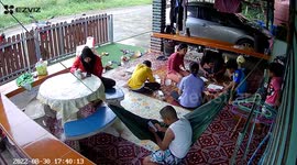 Boy falls from roof as family relax on patio