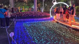 Chiang Mai's festival of flowers, evening and the park is lit up.