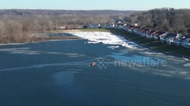 Firefighters rescue deer trapped on thin ice in Grand Rapids Lake