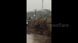 Wires above train spark as harsh weather disrupts Chinese New Year travellers