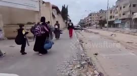 Displaced Palestinians Evacuate Besieged Al-Amal Hospital in Khan Yunis