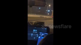 Blazing truck with big load of hay on highway in Chengdu, China