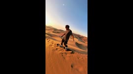 Sandboarding On The Dunes