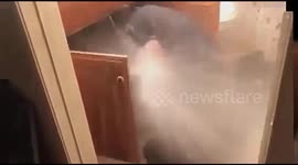 Water pipe gives out causing a massive jet of water from the cupboard.