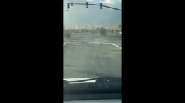 Atmospheric river sends sea of tumbleweed across road in California