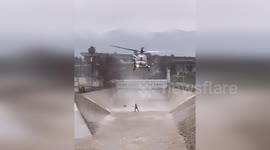 Firefighters rescue man who jumped into raging river to save pet dog in California