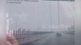 Ice pillars fall onto cars passing through bridge in central China