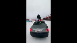 Daring aerial leap: Russian stuntman Chebotarev takes on two planes and a moving car in thrilling stunt