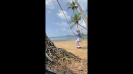 Swinging siblings: hilarious backflip mishap at Pantai, Nirwana, Indonesia!