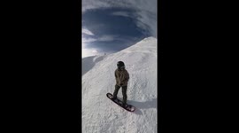 Snowboarder Catches an Edge and Tumbles Down Steep Slope