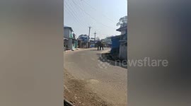 Wild elephant rampages through village knocking over motorcycle in India